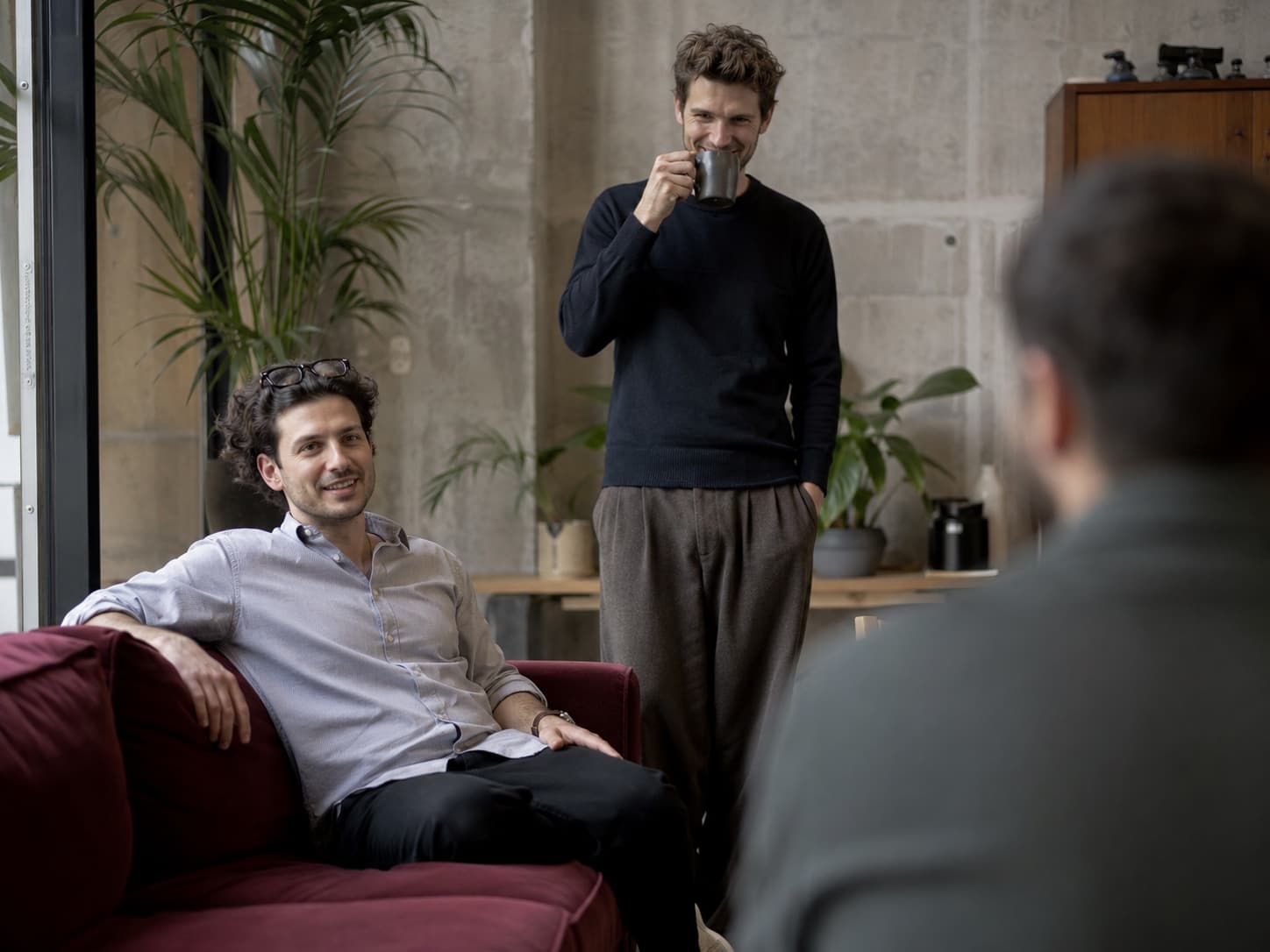 Team talking in an office lounge